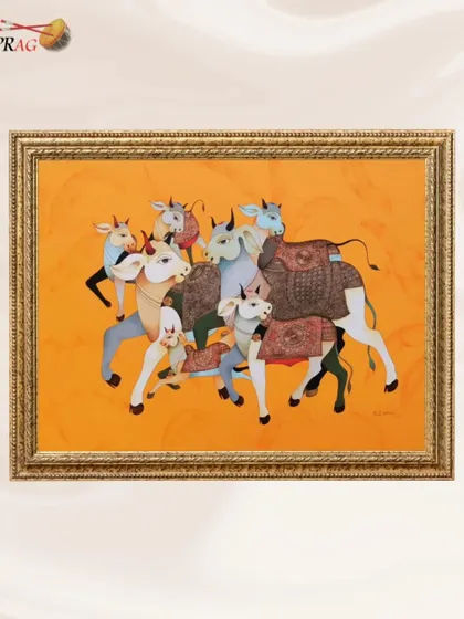 A framed painting of 'Joyful Bulls' by Ashok Nellagi, demonstrating how a traditional gold frame can enhance the artwork's warmth.