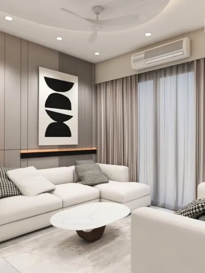 A modern living room with a white sectional sofa, minimalist art, and vertical wall paneling. The design emphasizes clean lines and a calm, uncluttered atmosphere.