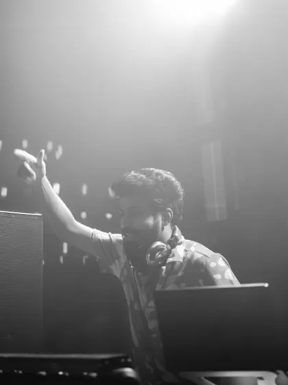 A black and white shot of me pointing to the crowd, creating a connection from the DJ booth.