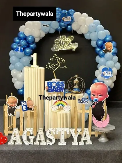 A cute Boss Baby setup with a tree prop and a heart-shaped light, adding a touch of whimsy.
