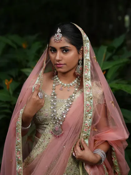 This shot captures the regal feel of the complete bridal look, with the pastel jewellery adding a touch of modern royalty.