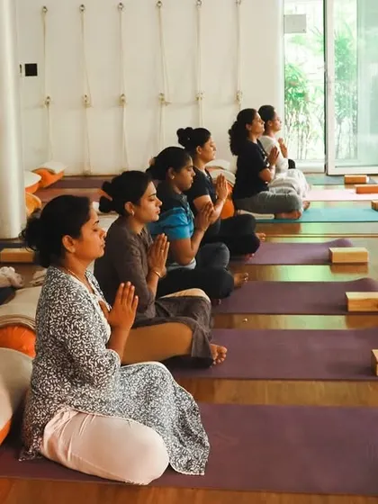 A moment of shared intention at the start of a Hatha yoga class. The Anjali mudra (prayer hands) helps center our energy as a group before we begin to move.
