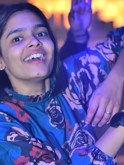 A happy face in the crowd, enjoying the music and the atmosphere.