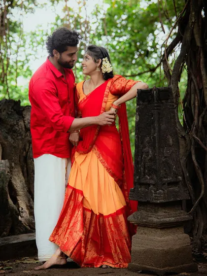 A romantic portrait of a couple by ancient stone ruins, blending history with their love story.
