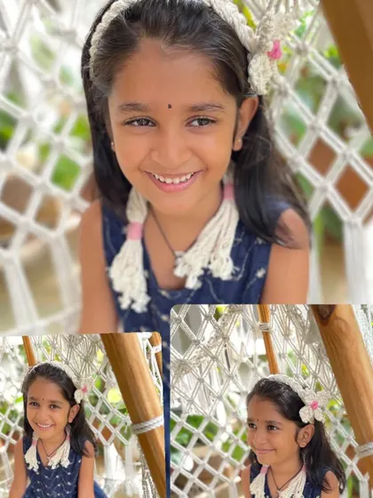 This sweet girl is all smiles wearing her off-white flowery bandana. The neutral color makes it a versatile hair accessory, and the adjustable ties ensure a comfortable fit for any child.