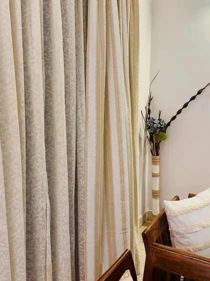 A closer look at the beautiful texture of our Caramel and Trailing Berries sheer curtains. The combination of a solid and a subtle pattern adds visual interest without overwhelming the space.