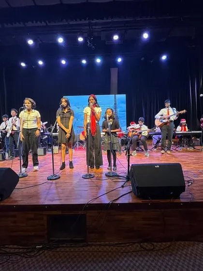From the classroom to the main stage, we give students the confidence to perform. Here, our students are showcasing their vocal and guitar skills at our annual music festival.