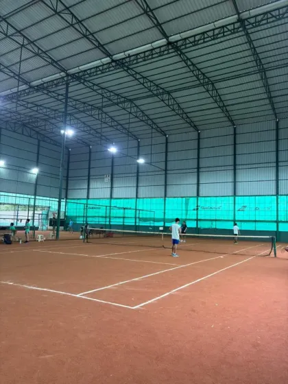 A wide view of the competitive action at the inter-academy tournament, with multiple matches happening simultaneously.