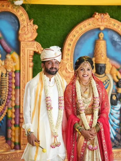 The lovely couple posing against a traditional backdrop. I created a classic bridal look for Bindu that photographed beautifully and lasted through all the ceremonies.