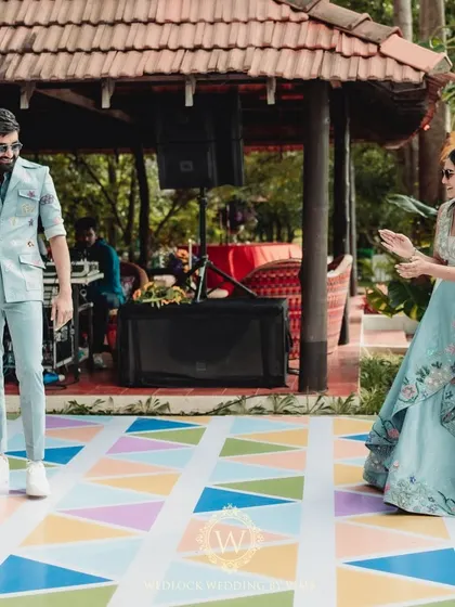 We designed this Haldi and Mehendi with multiple unique color palettes. The decor featured everything from stunning yellow and blue floral arrangements to lively orange accents for a truly dynamic celebration.