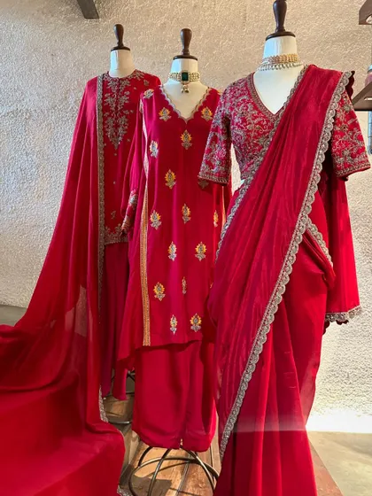 A collection of classic red outfits for the festive season. Whether you prefer a simple suit or an embroidered saree, red is a color that always signifies celebration.