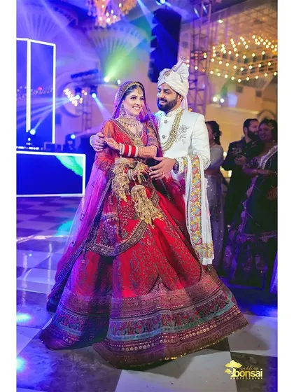 A happy, candid shot of the couple during their wedding reception.
