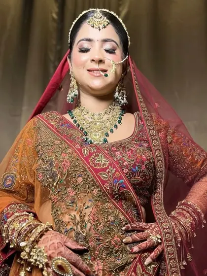A happy and serene shot of the bride, her eyes closed in a moment of bliss.