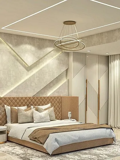 A render of a luxurious master bedroom, featuring a quilted leather headboard, a textured wall with gold inlays, and integrated lighting to create a glamorous and sophisticated retreat.
