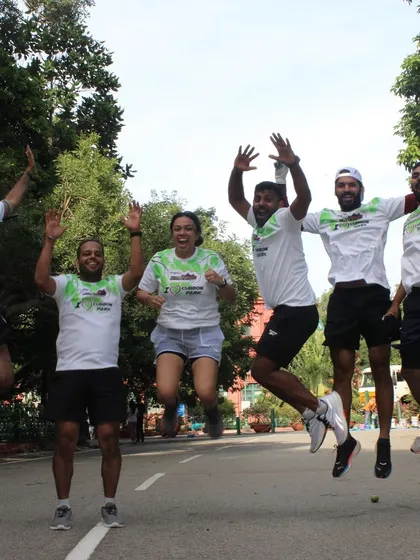 The pure joy of giving back to the community. A celebratory jump shot after a successful day of painting at Cubbon Park.