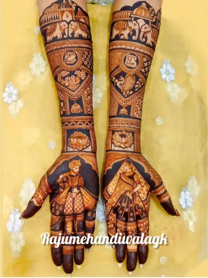A stunning example of my portrait work, with the bride and groom depicted in royal attire on the palms. The arms are filled with elephants, peacocks, and other traditional wedding symbols.