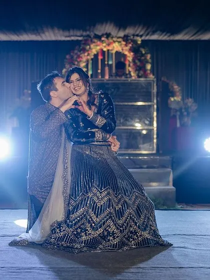A sweet kiss at the end of their performance. A perfect finale to their Sangeet dance.