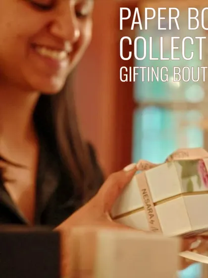 At the Paper Boat Collective gifting boutique inside our cafe, you can find beautiful, handcrafted presents. This customer is looking at a set of elegantly packaged soaps, a perfect thoughtful gift.