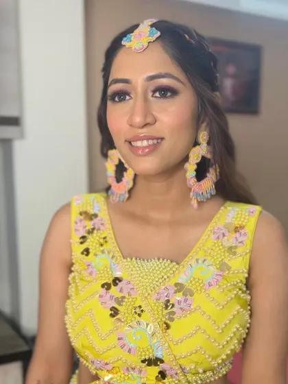 A close-up of the Haldi bride's makeup, showing the fun pink winged liner.