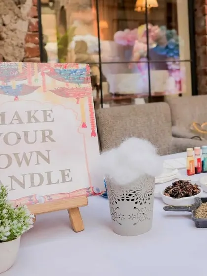 The full setup for the 'Make Your Own Candle' station, an activity that is both fun and therapeutic.