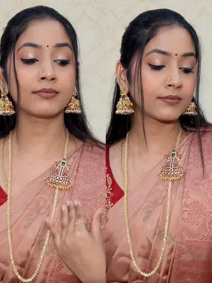 A beautiful shot showcasing a traditional long necklace (haram) paired with a simple silk saree.