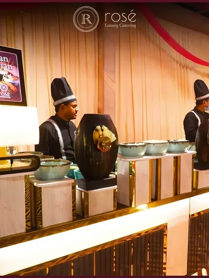 Our Pan-Asian live station, elegantly set up with our chefs ready to serve. The illuminated sign and sophisticated decor ensure the station is a stylish addition to your event's theme.
