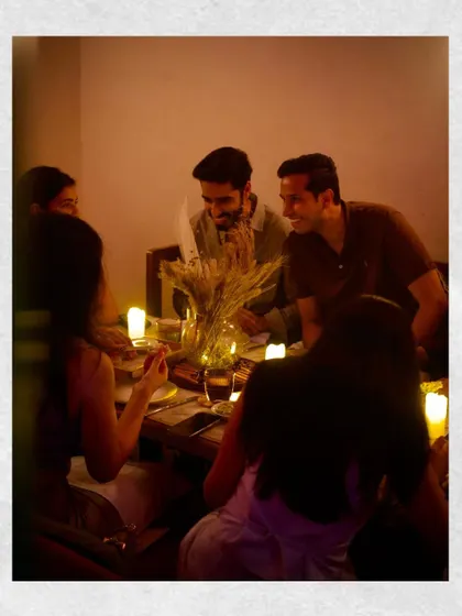 A candid moment of conversation and connection during our menu preview dinner.