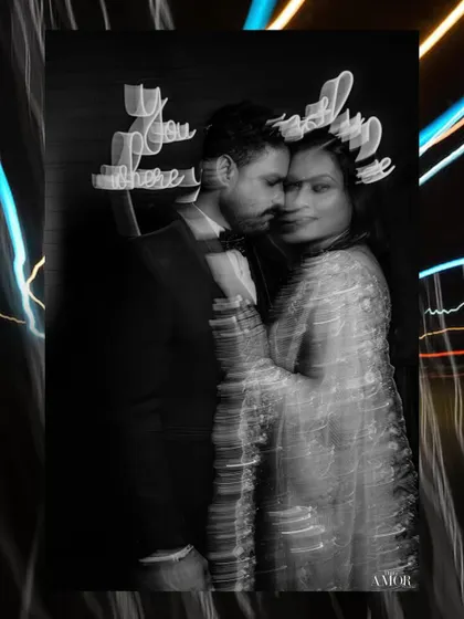 An abstract black and white portrait with motion blur and light streaks. This experimental technique creates a dreamy, ethereal quality, perfect for artistic wedding photography.