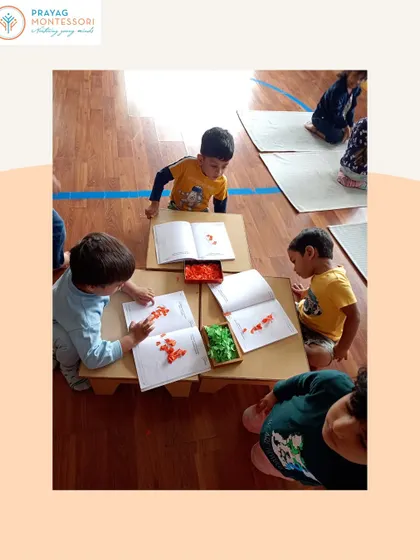 Working together on a creative art project using colors. This activity is not just about art; it's about collaboration, sharing materials, and expressing ideas.