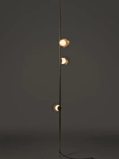A full-length studio shot of a vertical Bocci stem, highlighting its sleek form and the arrangement of the glass pendants.