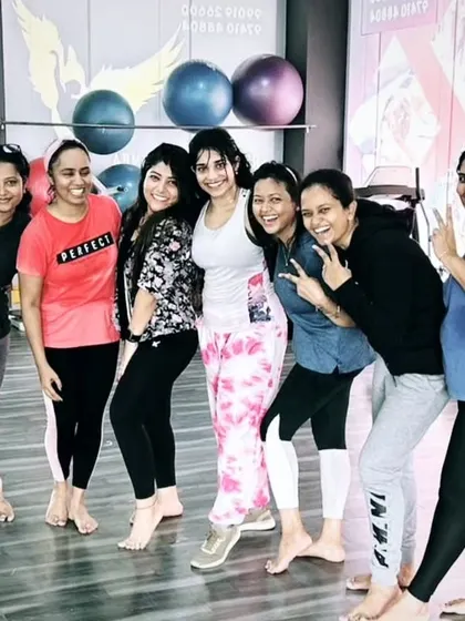 The heart and soul of my classes. Each photo captures a unique moment with my incredible community after a sweaty, joyful session. This is our shared victory lap.