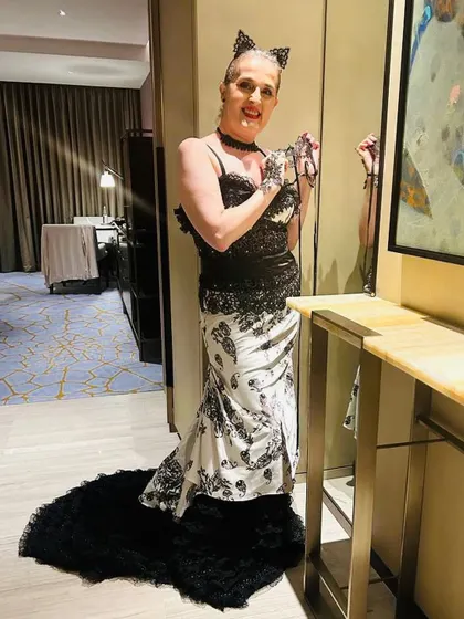 A full-length view of the stunning masquerade ball gown I styled for my client, Ruth. The dress featured a dramatic ruffled train that made her feel like she was at the ball.