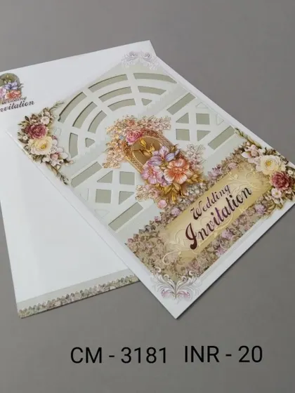 A simple and affordable invitation with a laser-cut window pattern and 3D floral details. This card offers an elegant look on a budget.