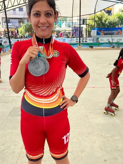 A happy moment with my two silver medals at the 60th National Championships. It's a privilege to compete alongside my students and bring home medals for our state.