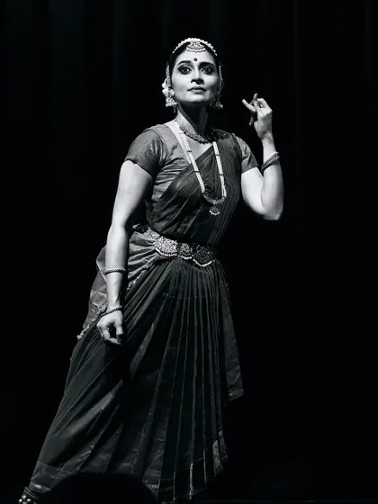 A black and white shot capturing a moment of deep thought during a performance at The Bhavan.