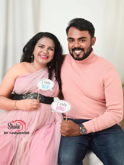A fun gender reveal moment during a maternity shoot. Our rental outfits are perfect for capturing all your special announcements.