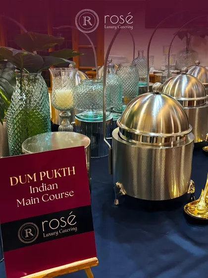 Our Dum Pukht Indian main course station, featuring slow-cooked delicacies. The signage and traditional serveware highlight the authenticity and rich heritage of the cuisine we offer.