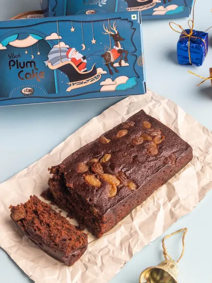 Our Rich Plum Cake bar, sliced and ready to serve. It's the same traditional recipe, full of spices and dried fruits, in a convenient loaf shape that's easy to share.