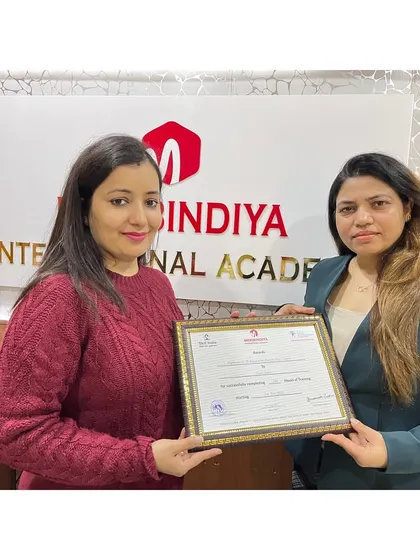 A moment of pride and achievement. This graduate is now ready to offer professional services to her clients.