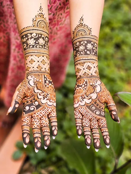 A stunning design with bold, dark floral patterns on the arm.