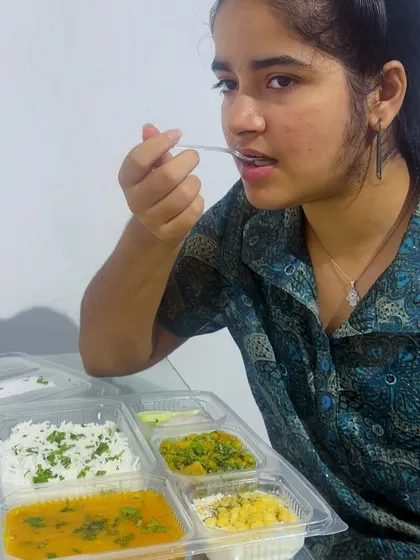 A happy customer enjoying her meal. Seeing you relish our food is the best feedback I can ask for.