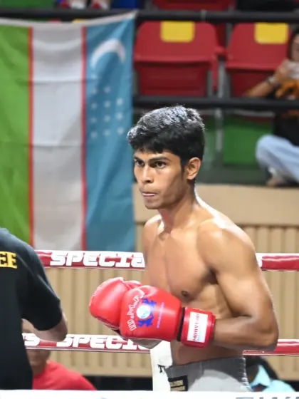 The intense focus of our fighter in the ring during an international Muay Thai tournament. Every fight is a learning experience, and we value the journey as much as the outcome.