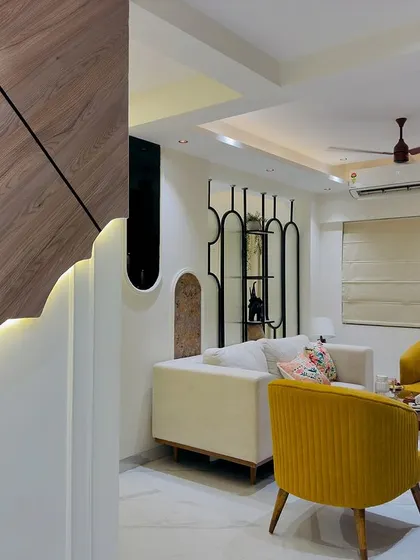 Another perspective of the unique backlit wall panel, which serves as a piece of art in the entryway of this 2BHK home.