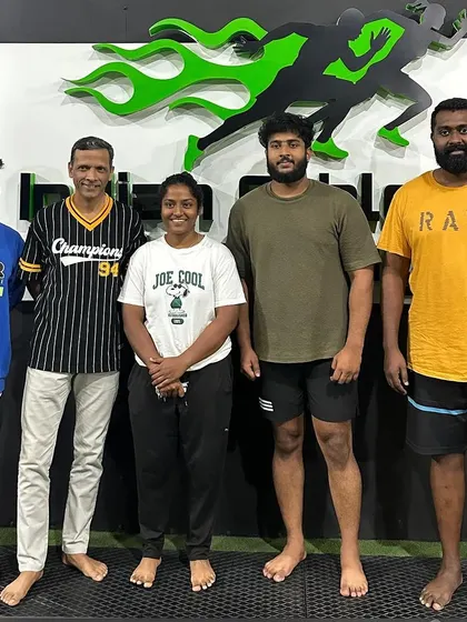 Our coaches and athletes with a visitor, sharing our training philosophy and community spirit.