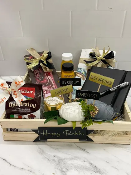 For the workaholic sibling, this crate combines sweet treats with customized stationery. It includes a 'Best Brother' diary and pen set, chocolates, and other goodies.