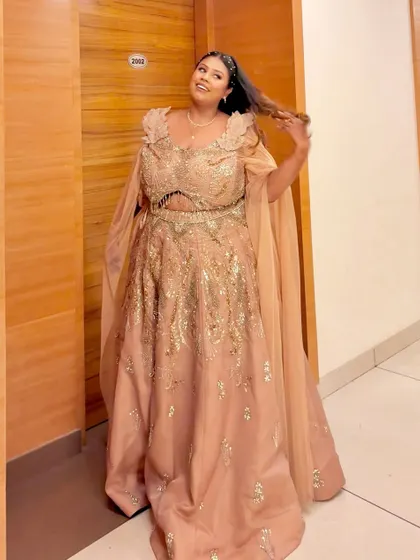 A candid moment of joy in the peach plus-size gown. It's moments like these that make my work so rewarding.