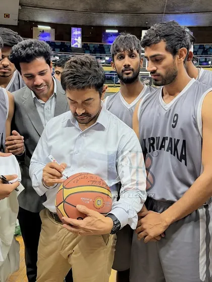 Another angle of Aamir Khan signing memorabilia for our players. These are the moments that inspire the next generation of athletes to dream big.