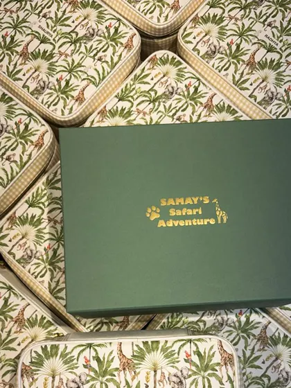 The custom boxes for "Samay's Safari Adventure." The gold foil lettering and jungle print lid set the theme from the very beginning.