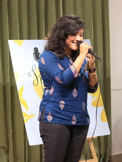 A singer lost in her song during a beautiful performance.