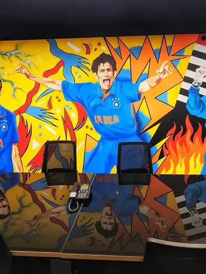This part of the mural captures the celebratory moments of Yusuf Pathan, Sourav Ganguly, and MS Dhoni in our signature colorful, graphic style.